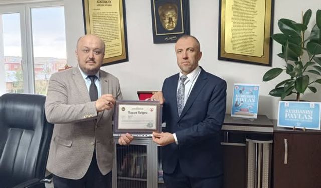 imam Murat Güveç'e başarı belgesi verildi